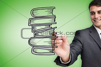 Composite image of businessman drawing books