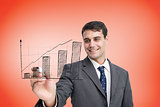 Composite image of businessman drawing graph