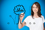 Composite image of businesswoman drawing idea tree