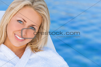 Woman Girl in White Spa Robe Blue Water Background