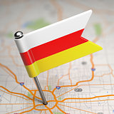 South Ossetia Small Flag on a Map Background.