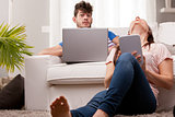 couple using pc and tablet