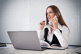 businesswoman talking on the phone in office