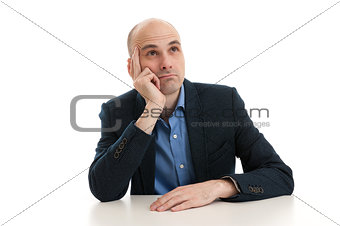 man sitting at the desk and dreaming