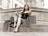 Young woman in the city with shopping bags