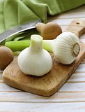 fresh organic garlic on a wooden kitchen board