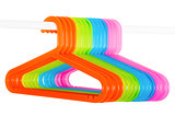 Colored hangers on a rod isolated on white