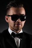 Gentleman. Attractive businessman in black suit