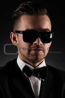 Gentleman. Attractive businessman in black suit