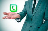 businessman with a telephone icon in his hand