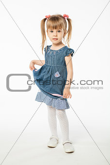 Cute blonde girl in blue dress