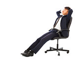 businessman sitting on a chair and holding head
