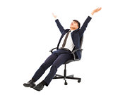 relax businessman sitting on a chair and raise hands