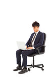 businessman using laptop on the chair