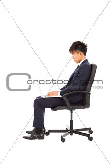 businessman using laptop on the chair