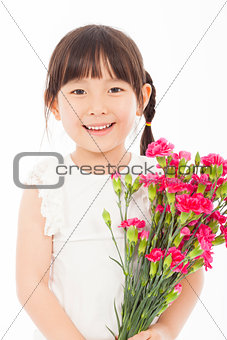 close up of little girl holding  a bouquet of carnations