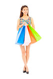 happy young woman holding shopping bags