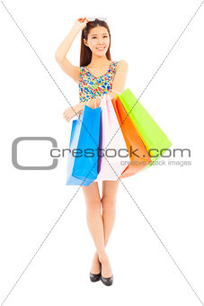 happy young woman holding shopping bags