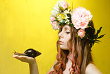 calm pretty girl with snail and flower crown on head