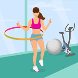 beautiful woman exercisingwith hula hoop in the gym