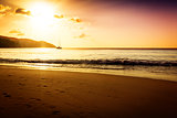 Gold sunset on the sand beach