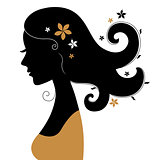 Retro woman silhouette with flowers in hair
