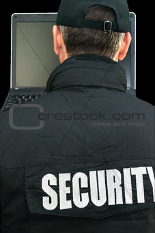 Security Working On Laptop, Over The Shoulder