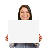 Isolated smiling young woman showing blank signboard