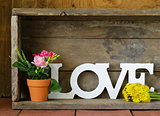 word love made of white wooden letters on vintage background