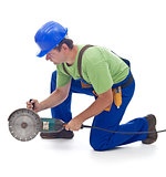 Worker with a power grinder