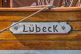 Wooden sign om a boat in the port of Lubeck