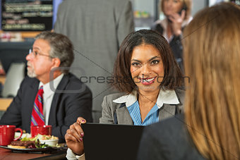 Woman in Cafe with Laptop