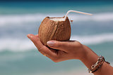 Coconut in a woman's hand 