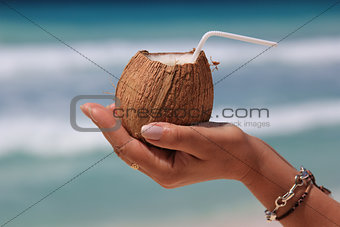 Coconut in a woman's hand 