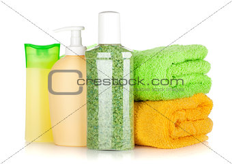 Cosmetics bottles with towels