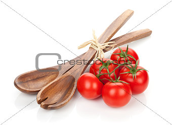 Ripe tomatoes and kitchen utensils