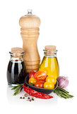 Olive oil, pepper shaker and vinegar with spices