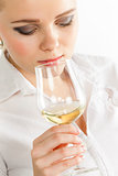 portrait of young woman tasting white wine