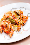 grilled skewers of prawns and lime in honey sauce