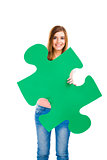 Woman holding a puzzle piece
