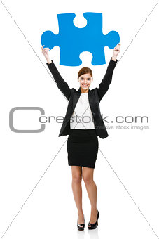 Businesswoman with a puzzle piece
