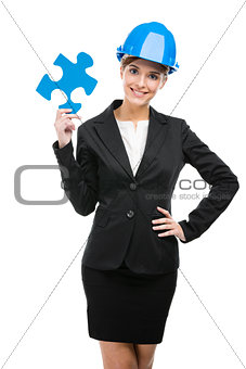 Female engineer with a puzzle piece