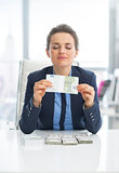 Business woman enjoying having money