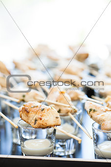 Chicken pieces on skewers