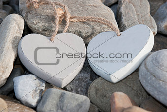 two love hearts on a rocky beach