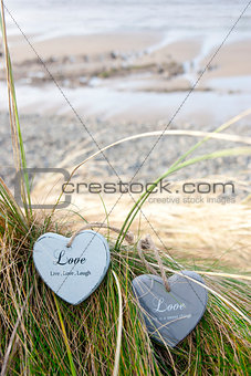 two love hearts on grassy sand dunes