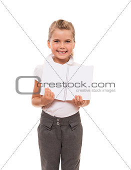 joyful little girl standing on white with open notebook
