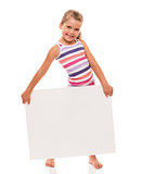 little girl is standing on white background and holding white ca