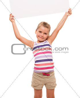 little girl is standing on white background and holding white ca