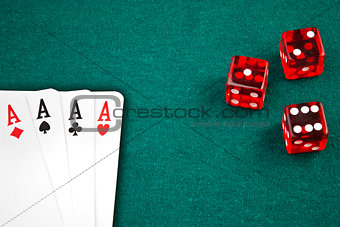 poker cards and dice on green